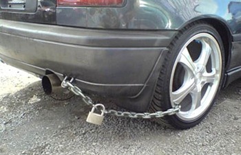 Car secured with a chain and padlock