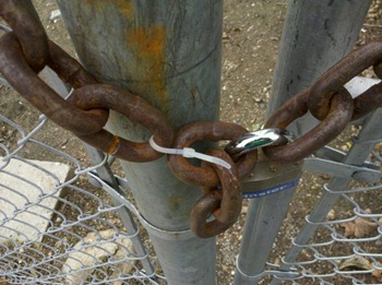 Chain secured with a padlock and cable tie