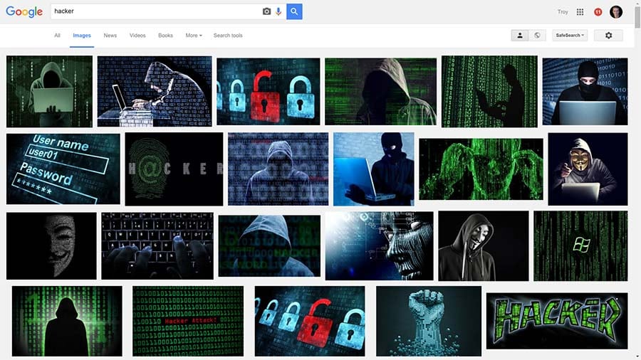 Images of hackers all with hoodies and green screens on a Google Images search